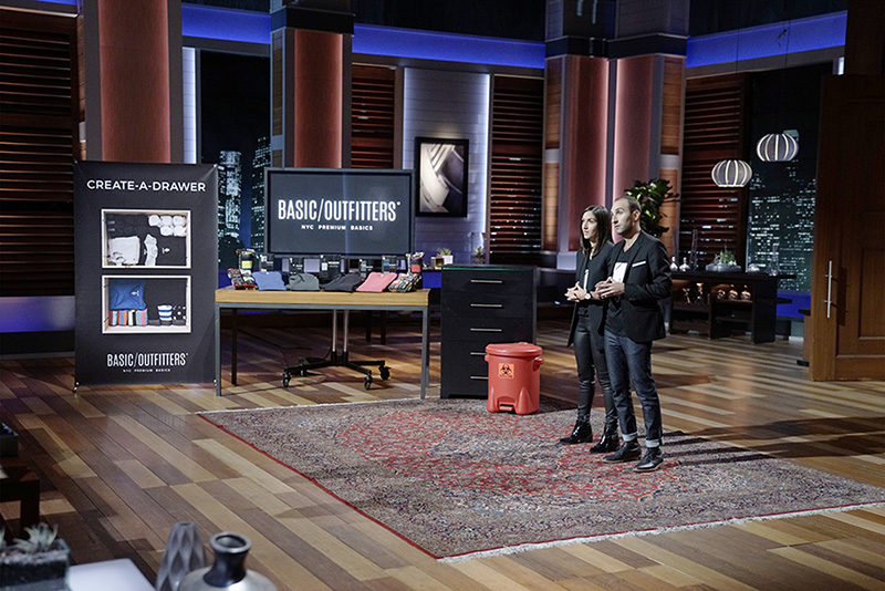 Two entrepreneurs pitch Basic Outfitters product on stage during business competition